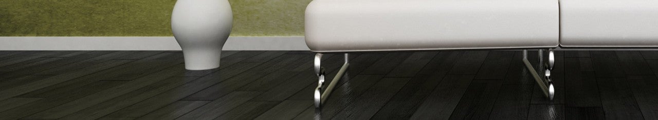 Wood floor with a sofa and a vase